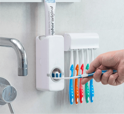 Tandkrämsdoserare med tandborsthållare